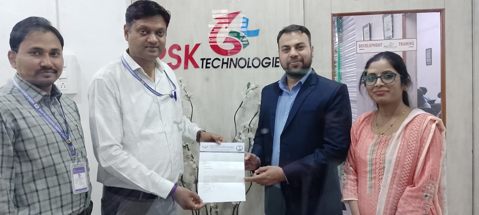 Gayatri Kadhao presenting a certificate to the lecturer during an industrial visit